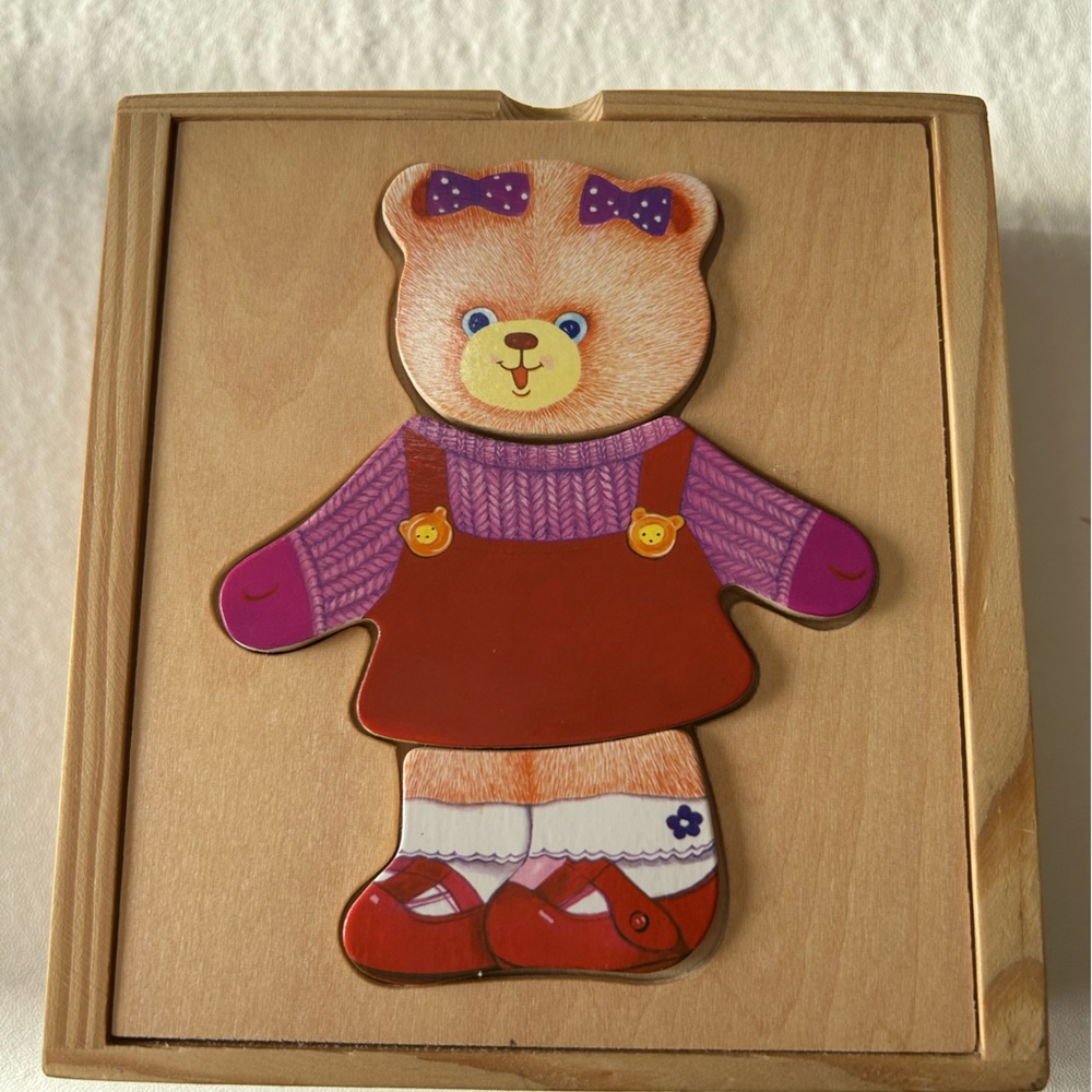 Wooden bear puzzle. Select from 6 faces, 6 outfits & 6 shoes to dress the bear